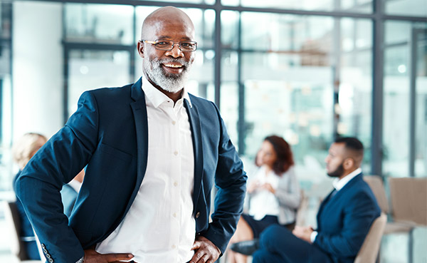 Black business man in front of board room