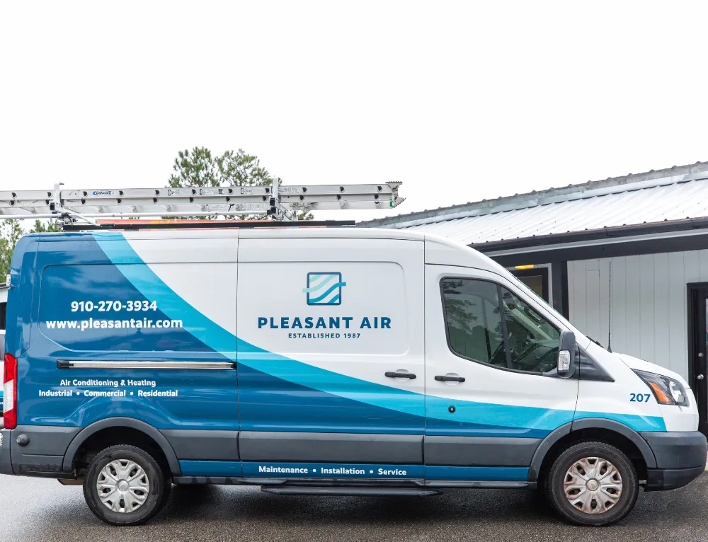 A van is branded with Pleasant Air's name, logo, and information