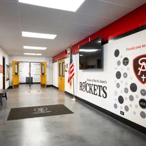 Wall in school painted with names of donors