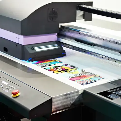 A photo of digital designs being printed