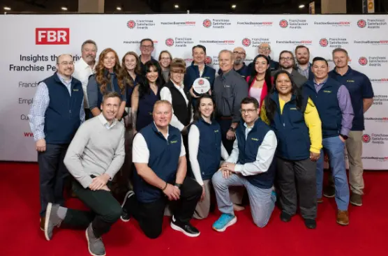 Group photo of the AlphaGraphics team at the IFA 2025 conference