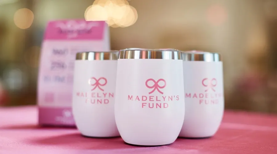 non profit branded promo tumblers in pink and white from AlphaGraphics