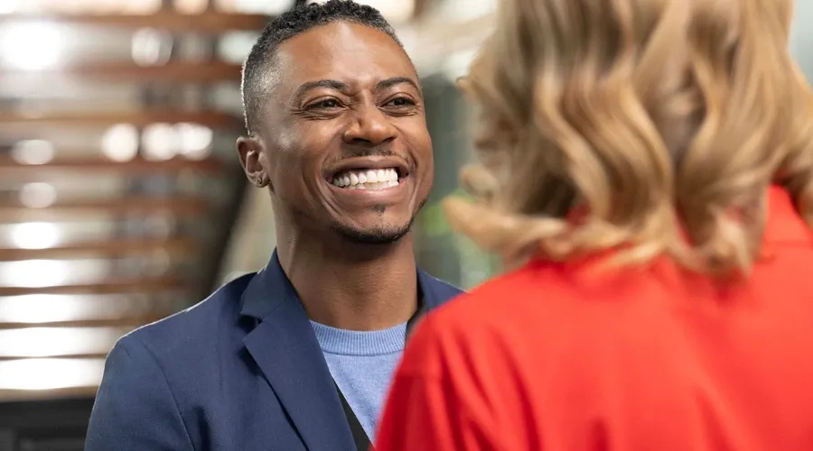 Business owner having a positive interaction with a customer, face-to-face in a square format